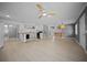 Spacious living room featuring wood-look floors, modern lighting, and an open layout at 219 Marion Oaks Ln, Ocala, FL 34473