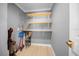 Walk-in pantry with several storage shelves, providing ample storage space at 219 Marion Oaks Ln, Ocala, FL 34473