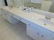 Bathroom featuring double sinks, lots of counter space, and tile flooring at 2909 Ne 25Th St, Ocala, FL 34470