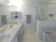 A well-lit bathroom with a large vanity and walk-in shower at 2909 Ne 25Th St, Ocala, FL 34470
