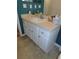 Bathroom featuring a vanity with a mirror and storage cabinets at 2909 Ne 25Th St, Ocala, FL 34470