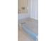 Bright bathroom featuring a soaking tub with a tile surround and shower at 2909 Ne 25Th St, Ocala, FL 34470