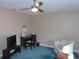 Bright bedroom featuring a ceiling fan, neutral walls, and a desk at 2909 Ne 25Th St, Ocala, FL 34470