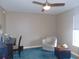 Bright bedroom with a ceiling fan, neutral walls, and a large window for natural light at 2909 Ne 25Th St, Ocala, FL 34470