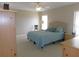 A carpeted main bedroom offering lots of space and natural light at 2909 Ne 25Th St, Ocala, FL 34470