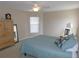 A carpeted main bedroom offering lots of space and natural light at 2909 Ne 25Th St, Ocala, FL 34470
