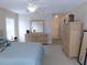 A carpeted main bedroom offering lots of space, closet, and natural light at 2909 Ne 25Th St, Ocala, FL 34470