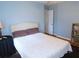 Bedroom with a bed, lamp, and a bookshelf at 2909 Ne 25Th St, Ocala, FL 34470