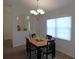 Charming dining room with modern chandelier and large window at 2909 Ne 25Th St, Ocala, FL 34470
