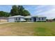 Inviting single-story home with a two-car garage, arched entry, and well-maintained front lawn at 2909 Ne 25Th St, Ocala, FL 34470
