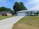 Attractive single-story home with an attached garage and well-manicured front lawn at 2909 Ne 25Th St, Ocala, FL 34470
