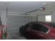 Attached garage features a secure door and a modern operating system at 2909 Ne 25Th St, Ocala, FL 34470