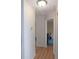 Hallway with hardwood floors leading to other rooms in the home at 2909 Ne 25Th St, Ocala, FL 34470