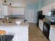 Bright kitchen with white cabinets and tiled floors at 2909 Ne 25Th St, Ocala, FL 34470