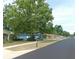 Street view of homes showcasing curb appeal and well-kept lawns on a sunny day at 2909 Ne 25Th St, Ocala, FL 34470