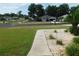 View of a home from across the street, with a meticulously maintained front yard and vibrant green landscaping at 2909 Ne 25Th St, Ocala, FL 34470