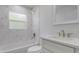 Bright bathroom features marble style tiles around the shower and a modern vanity sink at 400 Mariion Oaks Crse, Ocala, FL 34473