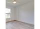 A bright and airy bedroom provides a serene escape with ample natural light and modern flooring at 400 Mariion Oaks Crse, Ocala, FL 34473
