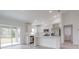 Modern kitchen with stainless steel appliances, white cabinets and counters, and a breakfast bar at 400 Mariion Oaks Crse, Ocala, FL 34473