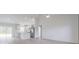 Bright, open living space with modern finishes, flowing seamlessly into the kitchen and dining area at 400 Mariion Oaks Crse, Ocala, FL 34473