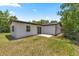 This house boasts a well kept yard and concrete patio, perfect for outdoor entertaining at 4095 Sw 144Th St, Ocala, FL 34473