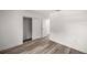 Bedroom with new wood flooring and bi-fold closet doors at 4095 Sw 144Th St, Ocala, FL 34473