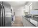 Updated kitchen featuring stainless steel appliances, new countertops, and plenty of natural light at 4095 Sw 144Th St, Ocala, FL 34473