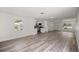 Bright and open living area with stylish floors that flow into the adjacent kitchen at 4095 Sw 144Th St, Ocala, FL 34473