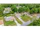 Aerial view of house, highlighting proximity to surrounding houses, driveways, and tree coverage at 5263 Nw 62Nd Nw Ave, Ocala, FL 34482
