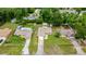 Aerial view of home, showing yard, fence, proximity to neighboring homes, and lush trees at 5263 Nw 62Nd Nw Ave, Ocala, FL 34482