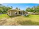 The well-maintained backyard features a screened in porch, new landscaping, and is partially fenced at 5263 Nw 62Nd Nw Ave, Ocala, FL 34482