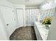 Bathroom featuring dual sinks, a shower with patterned curtain, and unique stone-look flooring at 5263 Nw 62Nd Nw Ave, Ocala, FL 34482