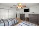 View of a bedroom with two beds, ceiling fan, and a closet; great for a Gathering or guests at 5263 Nw 62Nd Nw Ave, Ocala, FL 34482