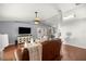 Cozy living room featuring hardwood flooring, TV, ceiling fan, and comfortable furniture at 5263 Nw 62Nd Nw Ave, Ocala, FL 34482