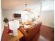 Inviting living room featuring a ceiling fan, hardwood floors, and comfortable seating arrangements at 5263 Nw 62Nd Nw Ave, Ocala, FL 34482