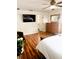 Stylish main bedroom with laminate floors, a dresser, and access to an ensuite bathroom at 5263 Nw 62Nd Nw Ave, Ocala, FL 34482