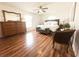 Bright and airy main bedroom featuring wood floors, ceiling fan, and natural light at 5263 Nw 62Nd Nw Ave, Ocala, FL 34482