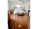 Bright bedroom featuring a ceiling fan, laminate floors, and a well-lit ambiance at 5263 Nw 62Nd Nw Ave, Ocala, FL 34482
