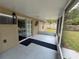 Screened-in patio with sliding doors and access to backyard views at 5263 Nw 62Nd Nw Ave, Ocala, FL 34482