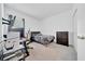 Carpeted bedroom equipped with a bed and TV on a stand at 5621 Sw 90Th Ln, Ocala, FL 34476