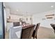 View of the dining area that leads to the kitchen with stainless steel appliances and modern design at 5621 Sw 90Th Ln, Ocala, FL 34476