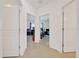 Hallway view showing entrances to multiple rooms at 5621 Sw 90Th Ln, Ocala, FL 34476