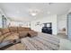 Open living room with sectional sofa and television at 5621 Sw 90Th Ln, Ocala, FL 34476