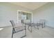 Covered patio featuring comfortable seating, perfect for enjoying the outdoors at 5621 Sw 90Th Ln, Ocala, FL 34476