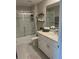 Clean bathroom with a shower-tub combo, marble vanity, and modern fixtures at 5667 Sw 92Nd Pl, Ocala, FL 34476