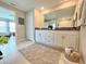 Bathroom featuring double vanity, granite countertops and neutral-toned walls at 5667 Sw 92Nd Pl, Ocala, FL 34476