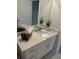 Bathroom vanity featuring a marble countertop, modern faucet, and decorative accents at 5667 Sw 92Nd Pl, Ocala, FL 34476