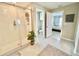 Bathroom featuring a glass-enclosed shower and view into the toilet room and bedroom at 5667 Sw 92Nd Pl, Ocala, FL 34476