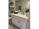 Clean bathroom featuring a shower-tub combo, marble vanity, shelves and modern fixtures at 5667 Sw 92Nd Pl, Ocala, FL 34476
