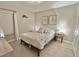 Bright bedroom with decor, a large window, and neutral walls create a serene and inviting atmosphere at 5667 Sw 92Nd Pl, Ocala, FL 34476